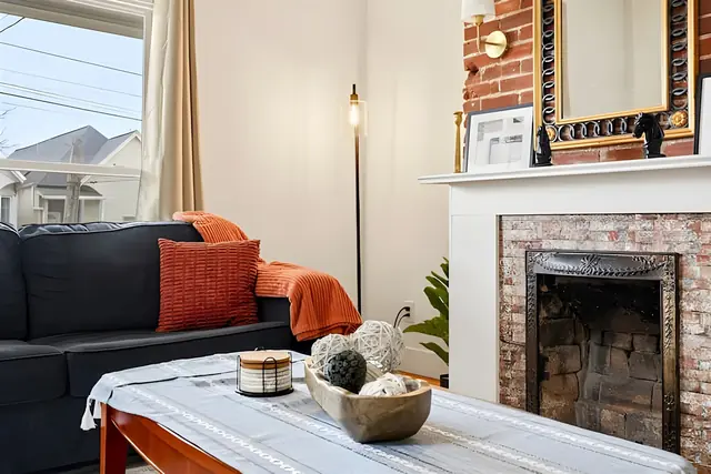 Historic Louisville 5BR Grand Charm Retreat: Living room fireplace
