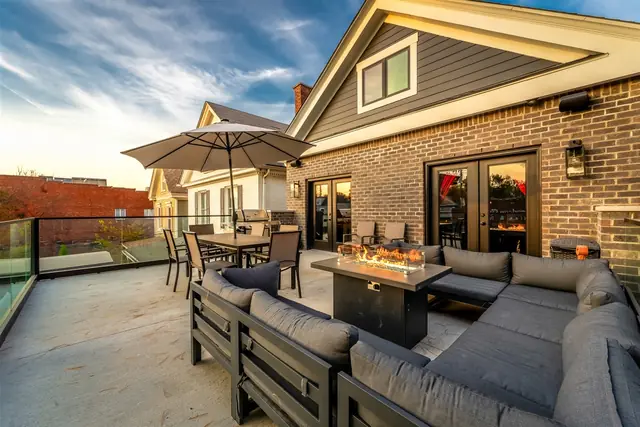 Untouchable Retreat: Rooftop terrace seating with fire table