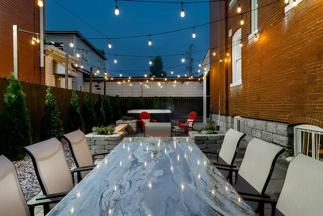 The Beechwood Estate | 13BR Highlands Compound Sleeps 32: Patio dining table with string lights