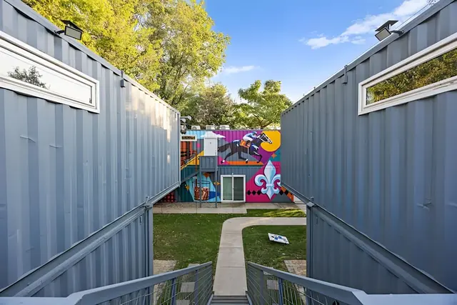 Modern Shipping Container Stay in NuLu | Unit 5: Walkway between the container units