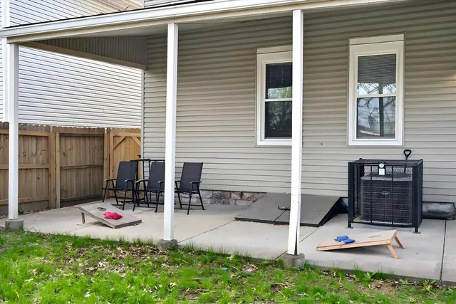 Elegant 2 Bedroom Garden Suite Historic Louisville | Sleeps 6: Covered patio with cornhole