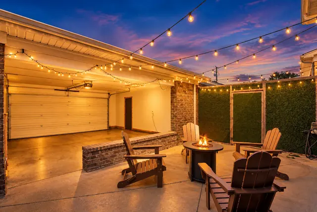 Lyndon Loft Oasis | 2BR Townhome with Private Garage: Covered patio with fire pit and string lights