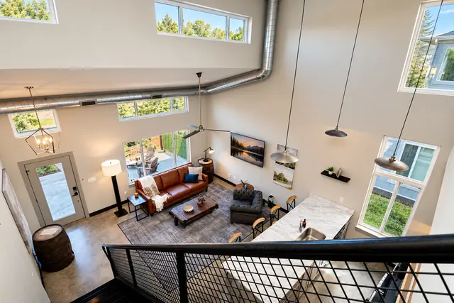 Lyndon Loft Oasis | 2BR Townhome with Private Garage: Living room seen from the loft stairs