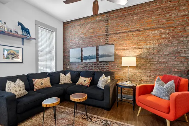 Churchill Backside-Bourbon Trail, EXPO & Derby!: Living room with sectional and orange chair