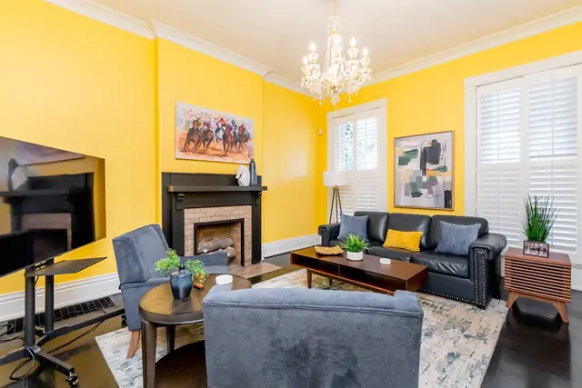 Highlands 8 BR 3BA: Living room with fireplace and leather sofa