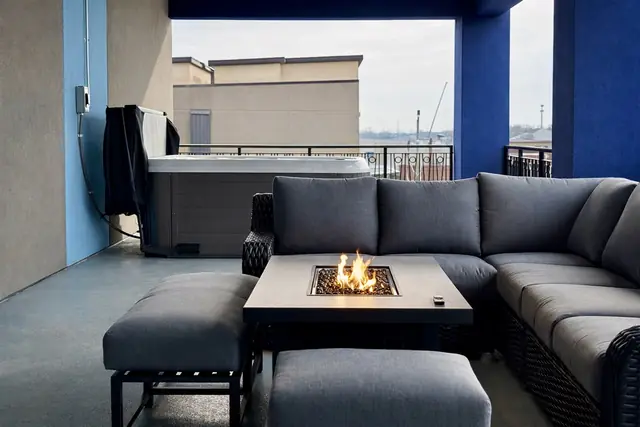 Ultra-Luxury NuLu Penthouse | 5BR, Hot Tub, City Views: Terrace sectional with fire table and hot tub