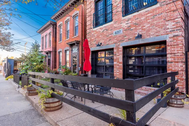Kentucky Stables and Saloon | 6BR Louisville Retreat: Brick facade and garage doors