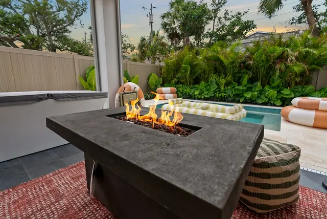 The Hibiscus House: Fire pit table by the pool
