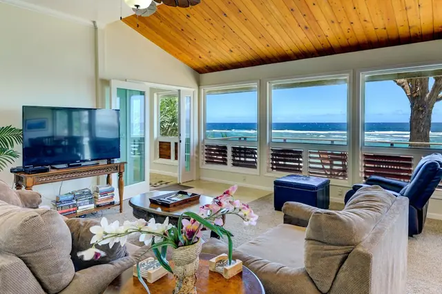 Anchorage Point: Living room with ocean-view windows