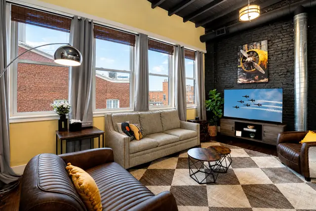 Wings Over Nulu | Luxury Industrial Loft Downtown Louisville: Living room seating