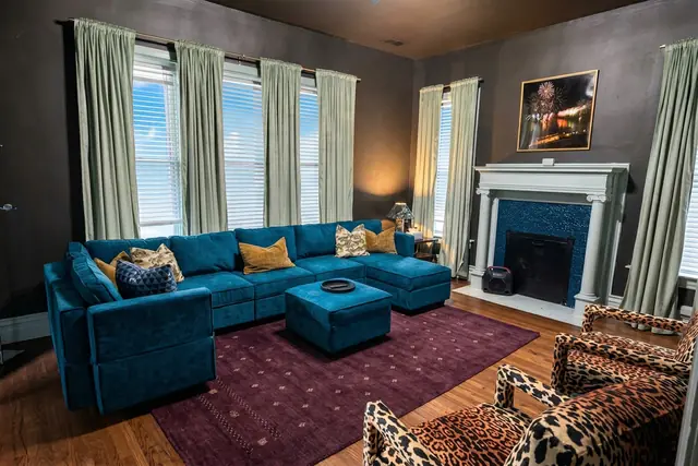 The Beechwood Estate | 13BR Highlands Compound Sleeps 32: Living room with teal sectional