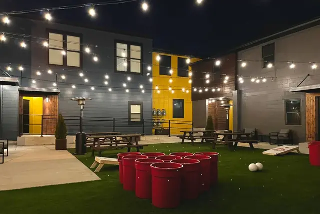 Bungalous Private Oasis: Courtyard with cornhole and seating