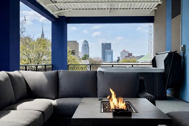 NuLu Skyline 11BR Mega Penthouse | Sleeps 32 | Louisville: Covered terrace with fire table and city views
