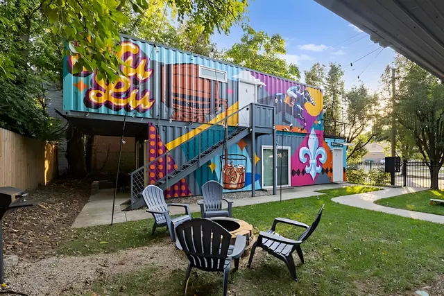 Modern NULU Container Loft | Private Deck | Urban Views: Mural building with fire pit seating