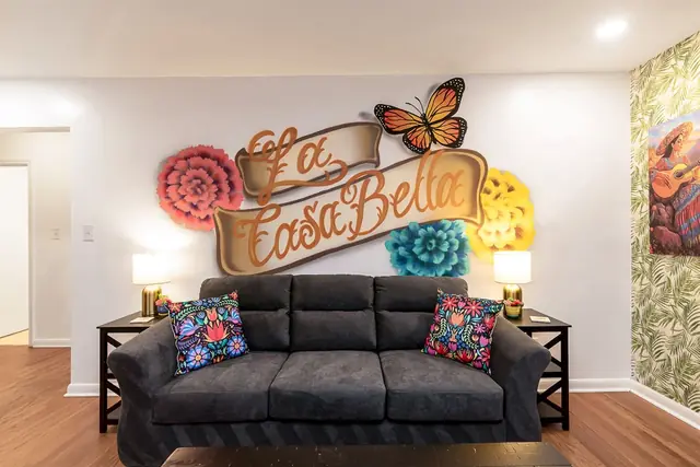 +51: Living room sofa and sign