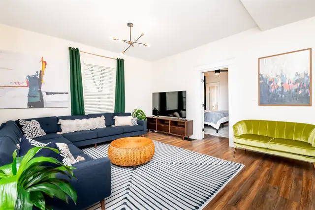 Highlands Farmhouse: Living room with navy sectional