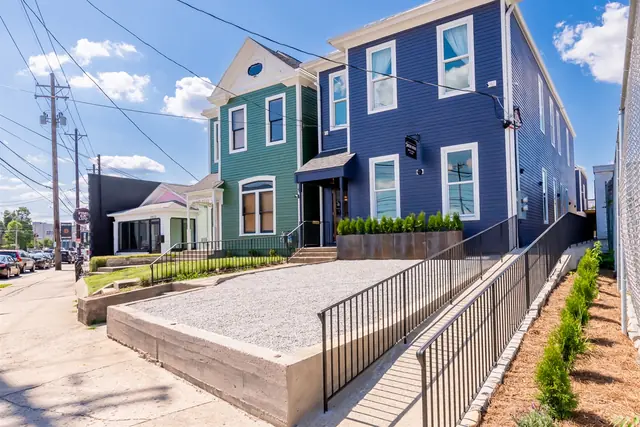 Angels Share: Blue and green townhomes on E Main