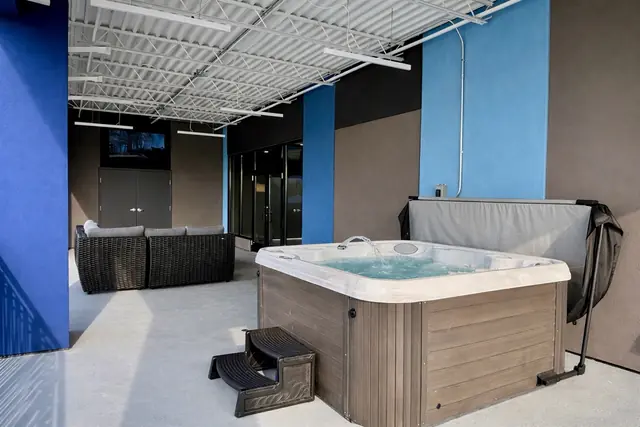 Ultra-Luxury NuLu Penthouse | 5BR, Hot Tub, City Views: Hot tub on the covered terrace