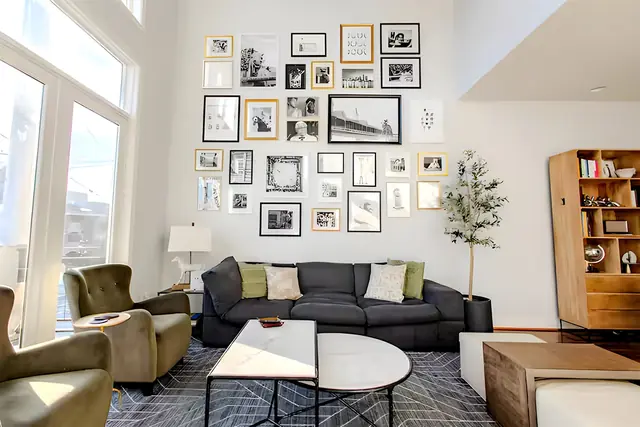 Gorgeous NuLu 2BR Retreat with Private Parking: Living room with floor-to-ceiling windows