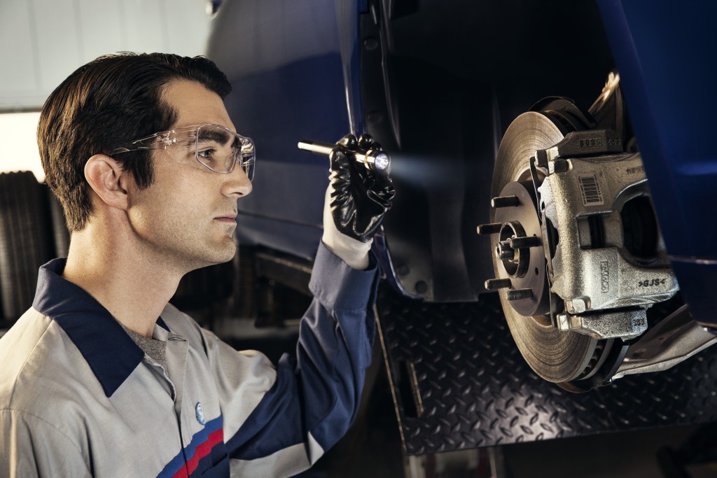 Ford technician checking brakes