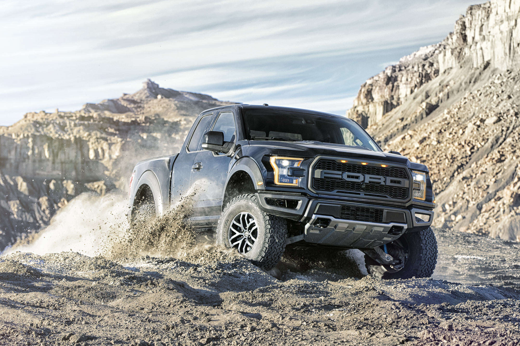 2017 Ford F-150 Black driving through mud and dirt