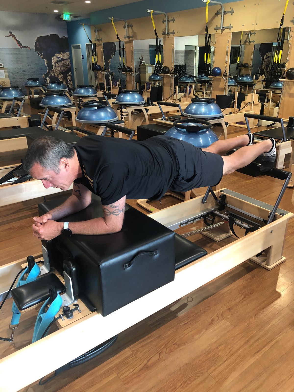 Armand holding a plank on the reformer