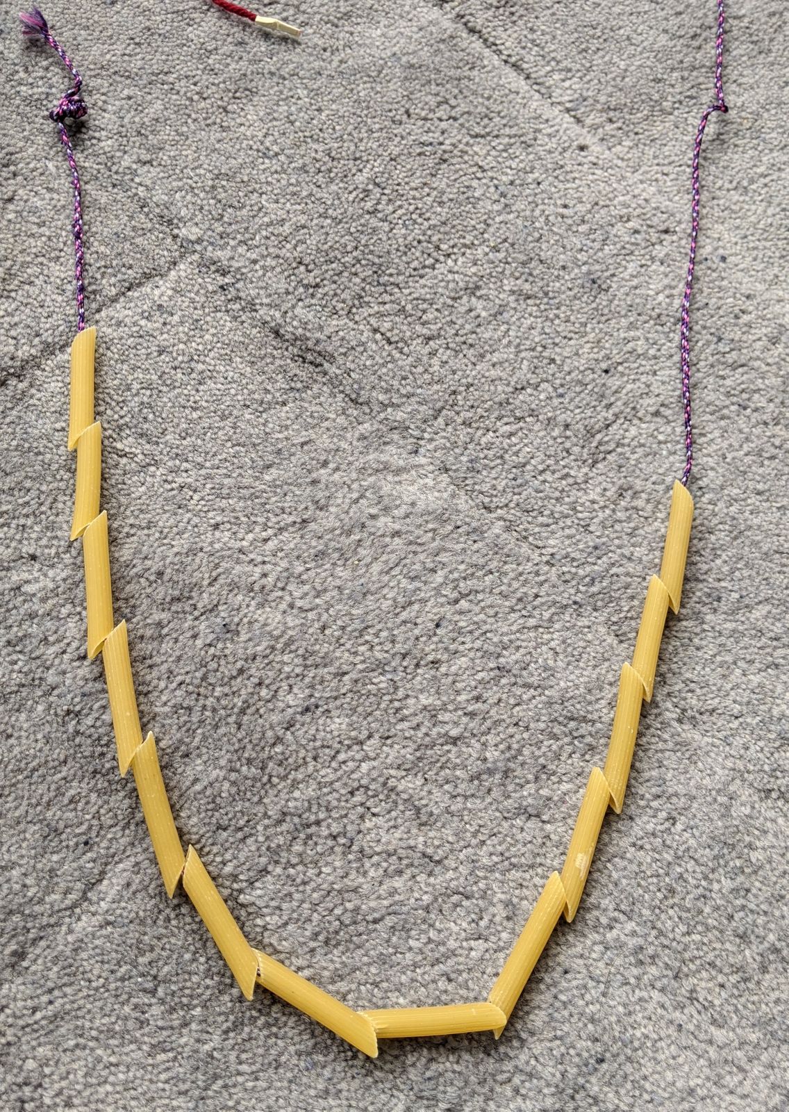 We ended up switching to this purple string because it was slightly thinner, but in the end, the pipe cleaner worked even with the maroon string.