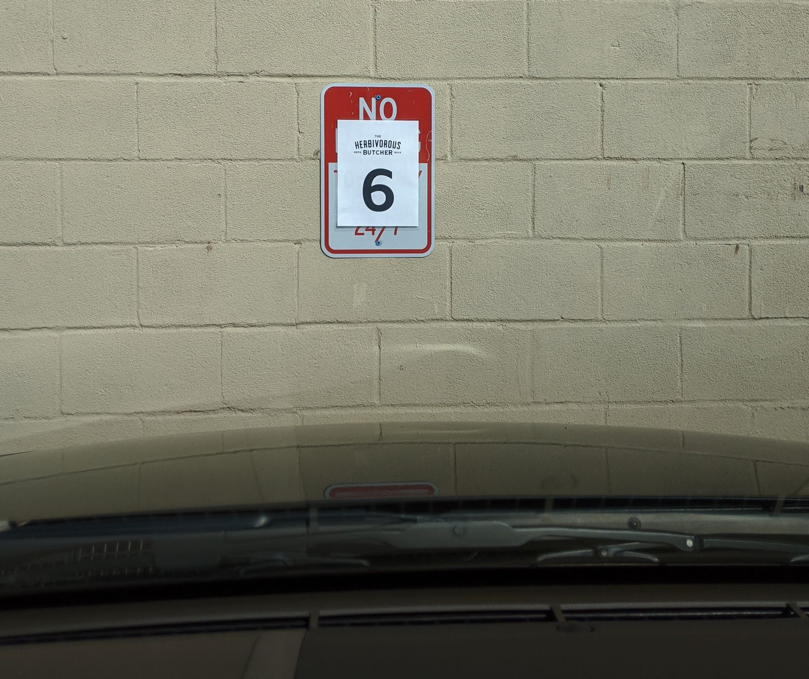 From the safety of my car, I wait.