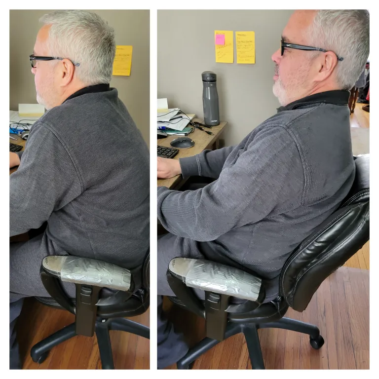 Christopher in the old chair with a static lumbar curve support that is too low.