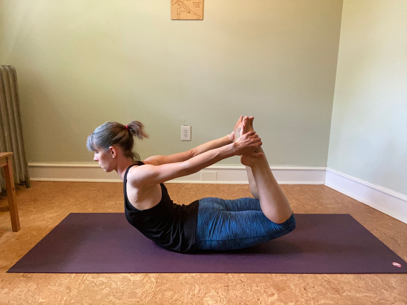 Holding the tops of your feet, pressing your feet back in space, and lifting your quads all increases the stretch along this front line.