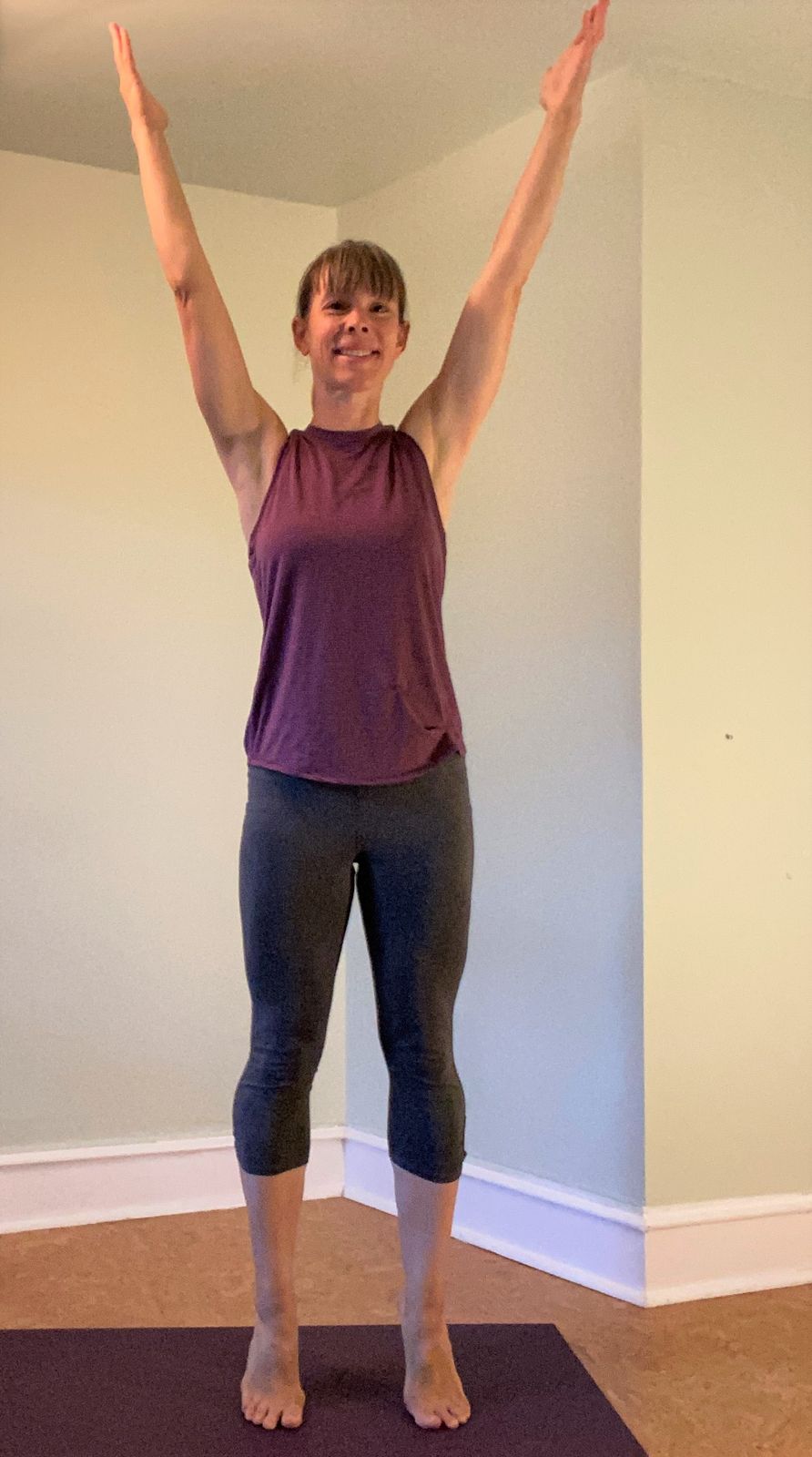 Stand with your feet hip width apart, toes pointing forward. On an inhale, lift onto the balls of your feet as you lift your arms out and up by your ears. Lift your heels straight up, not allowing much side to side movement. When your arms lift by your ears, palms are facing each other. Try one or two sets of 10.