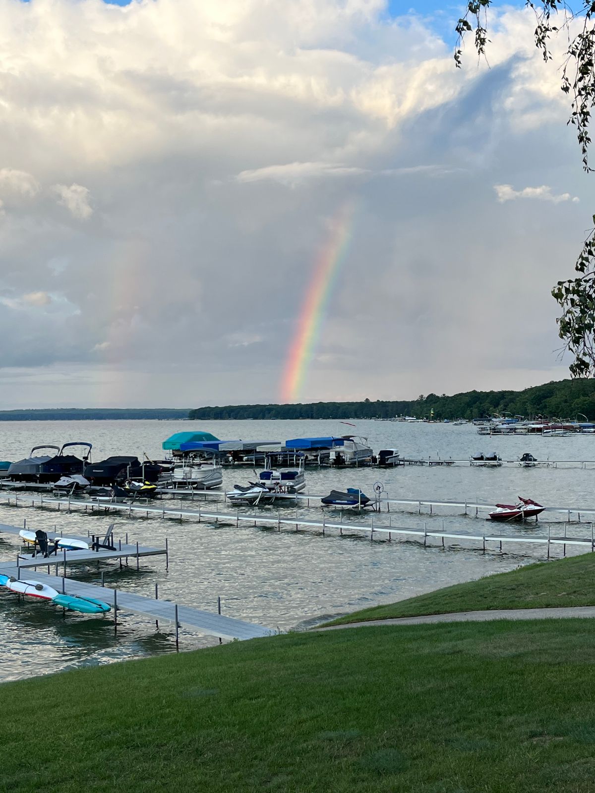 After a storm, a rainbow appears over Higgins Lake