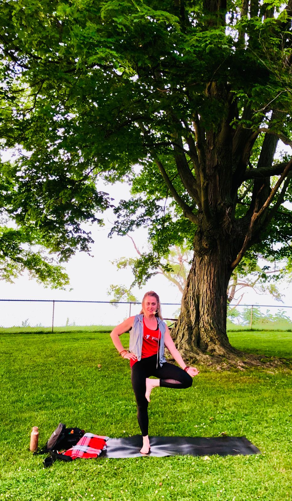 Erin doing TREE POSE one Summer during Fitness in the Parks... However this is not a YIN YOGA POSE its often used in VINYASA style classes... 