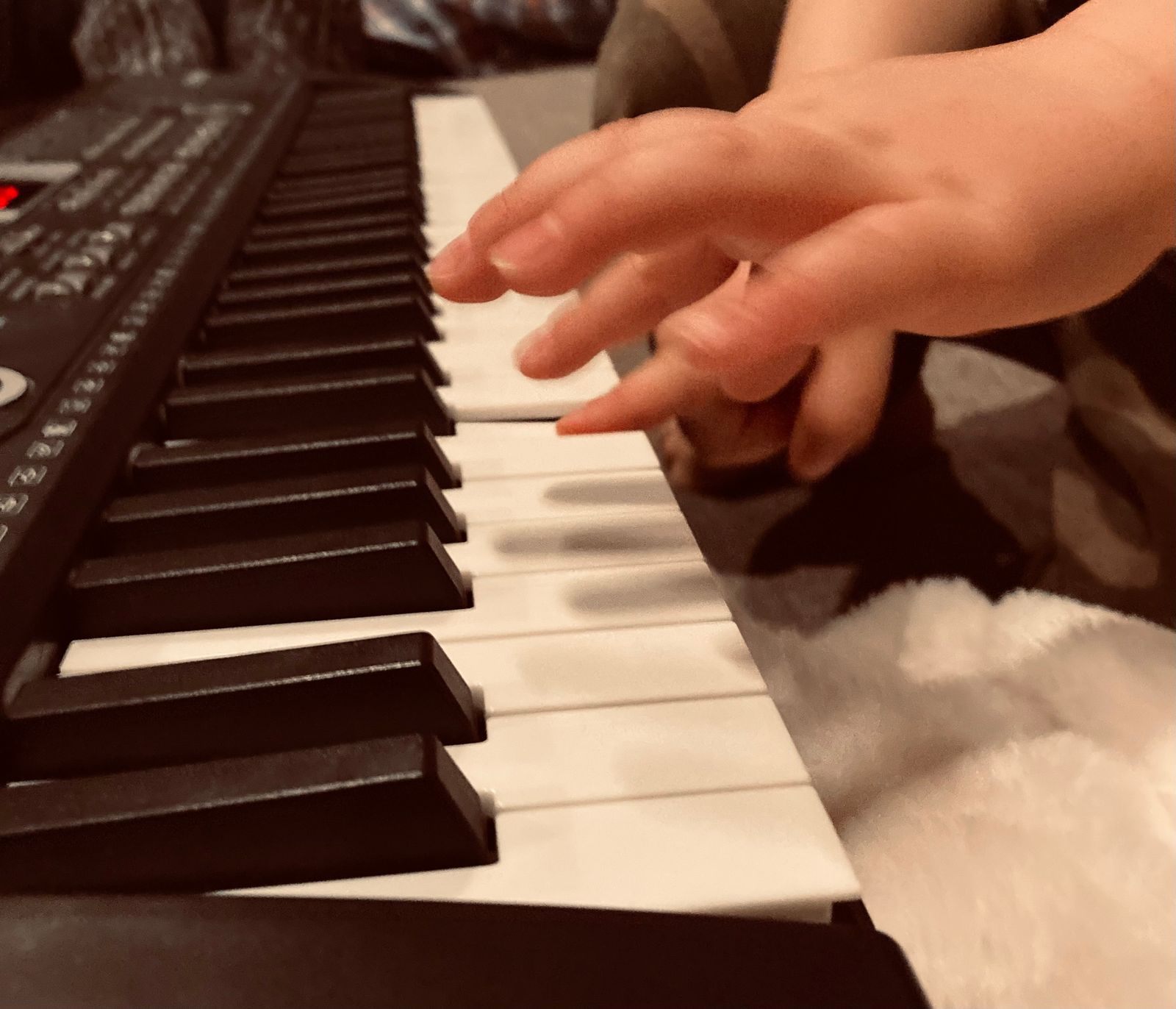 Little fingers discovering music.