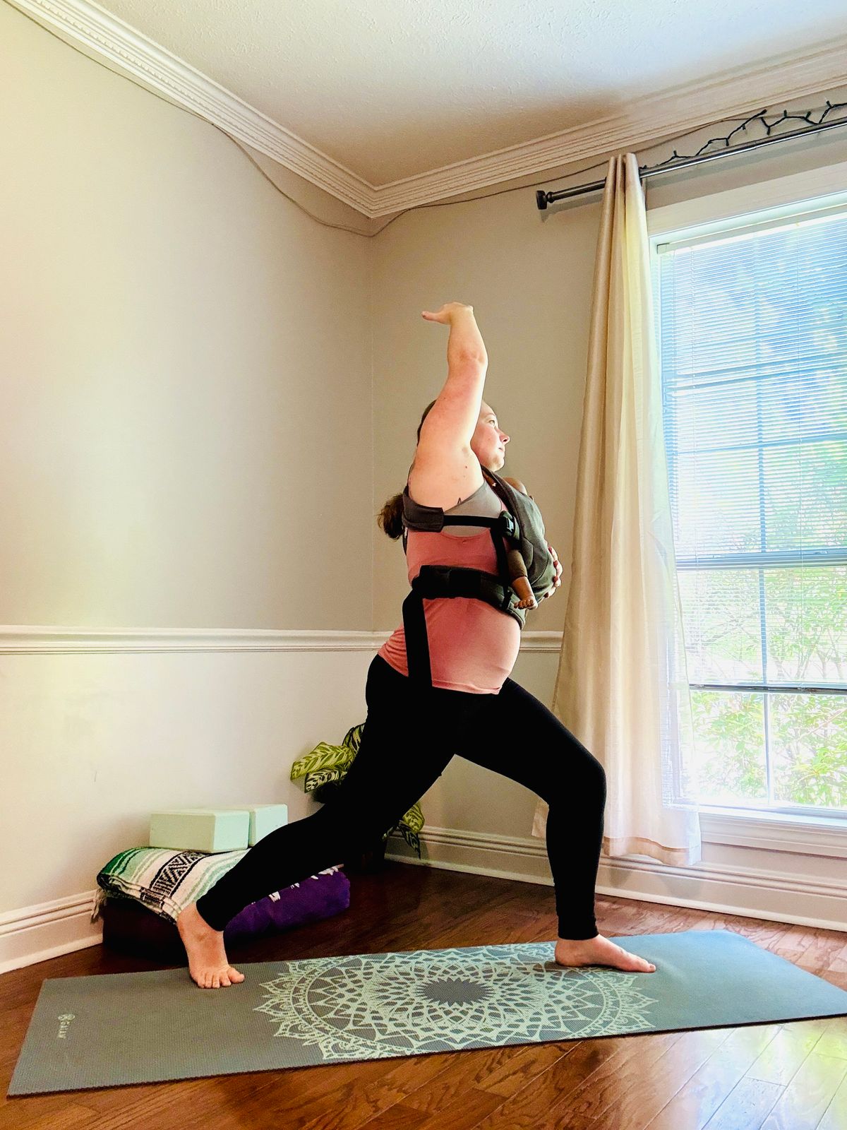 Inhale, one arm overhead – Keep the other hand on baby.
 