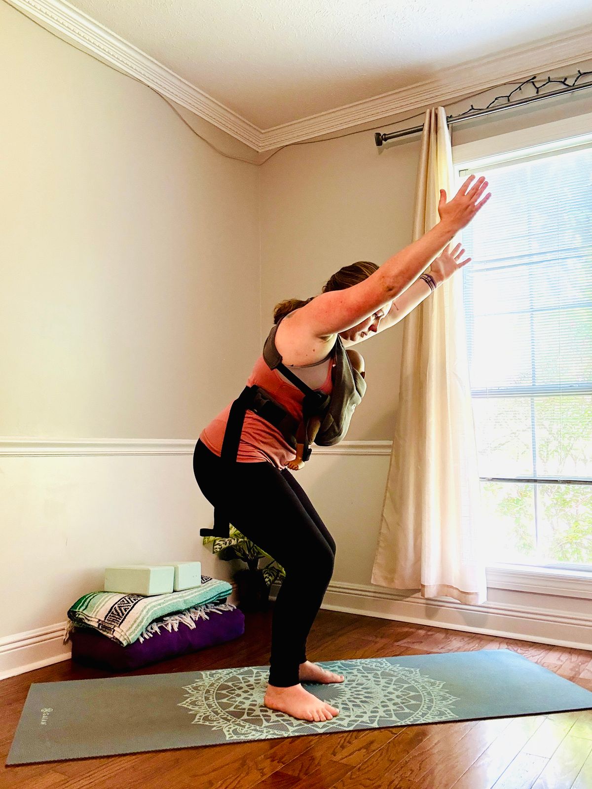 Inhale, lift arms - Exhale, sink hips back into chair pose (can have one or both hands on baby if needed)
