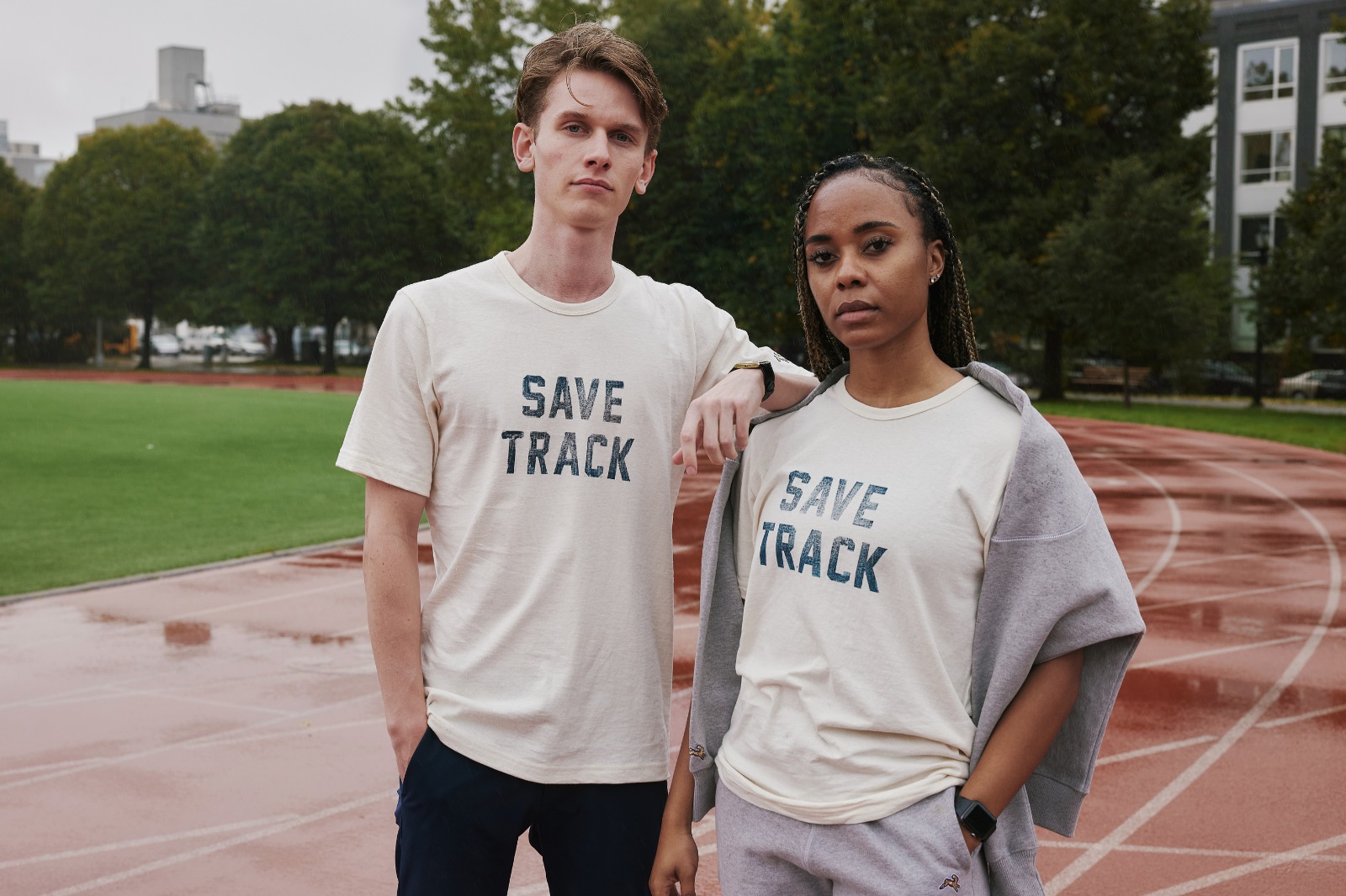 tracksmith save track grayboy on man and woman on running track