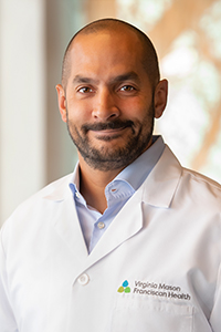 Portrait of Angel Reyes-Villanueva, MD, FACS, FASMBS, DABOM