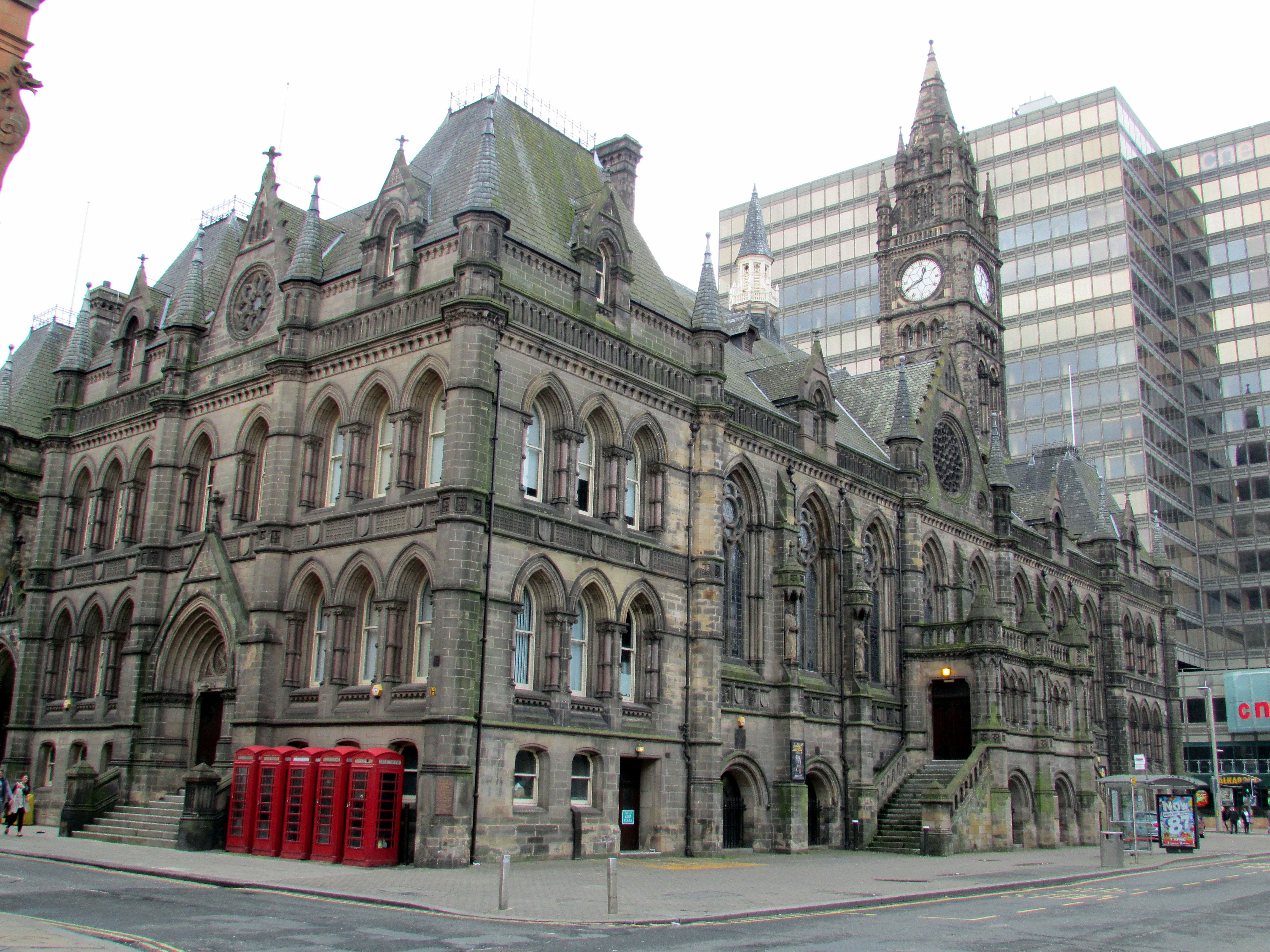 A municipal building with glass buildings in the background