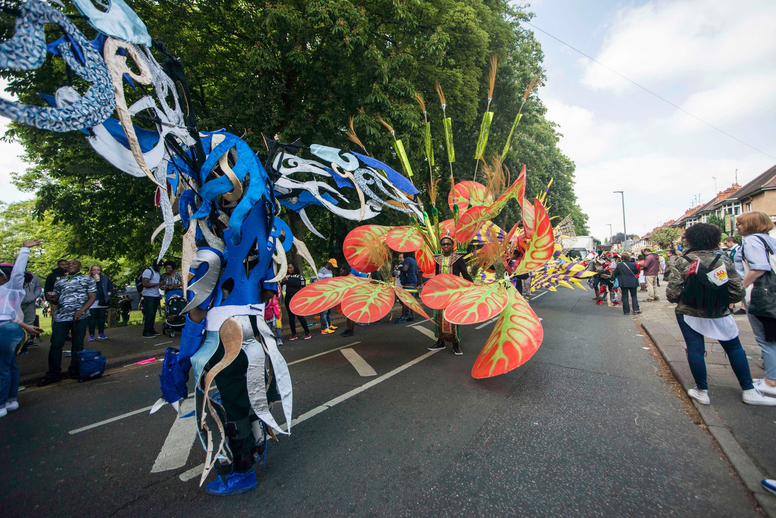 Luton Carnival with many people in colorful costumes