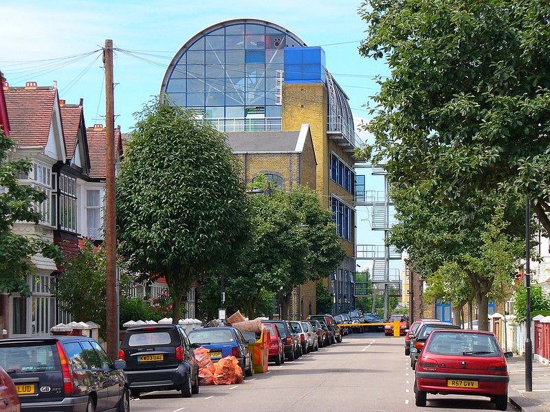 Cars parking alongside an empty street.jpg