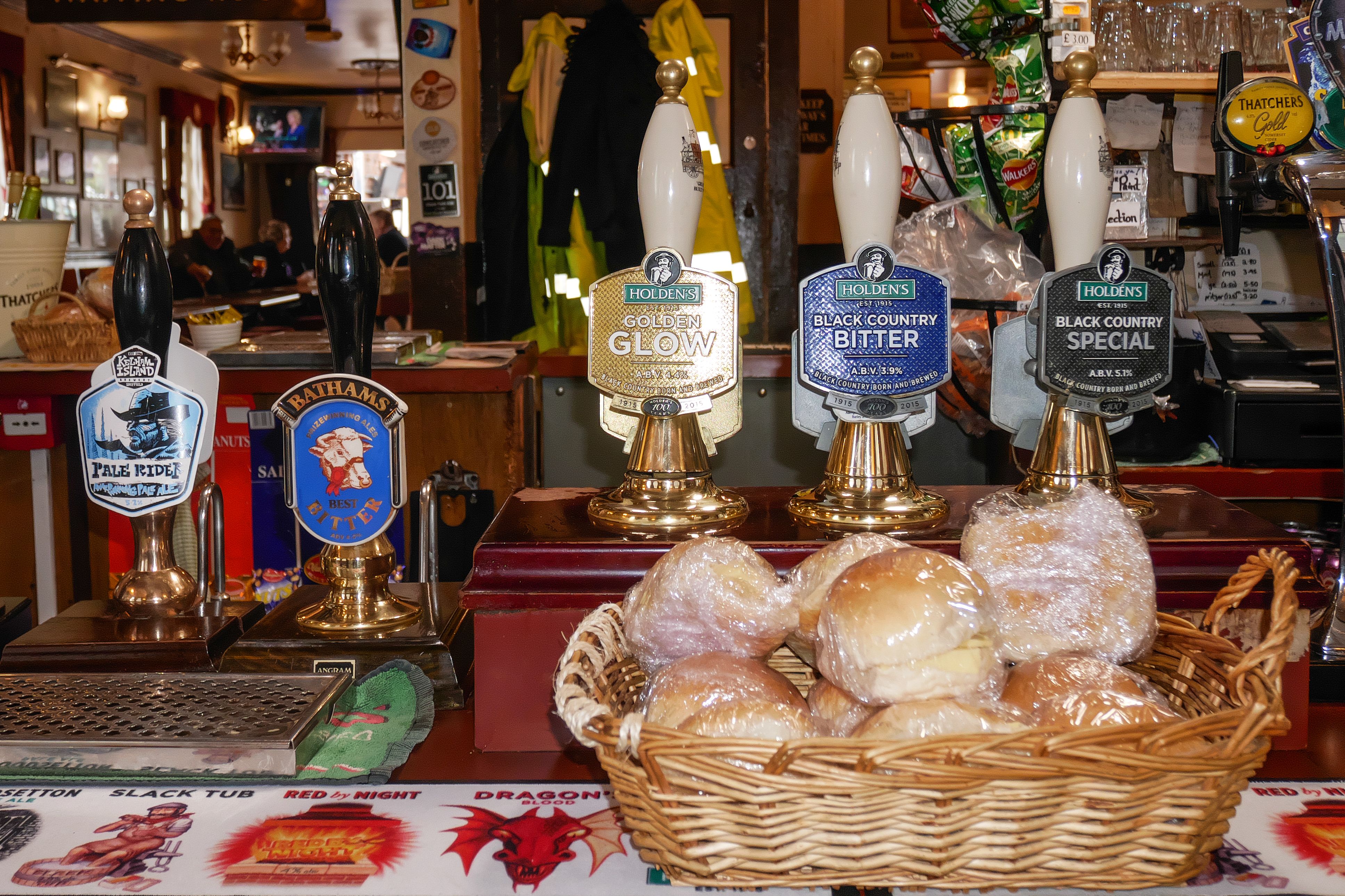 A basket of hamburgers on a bar