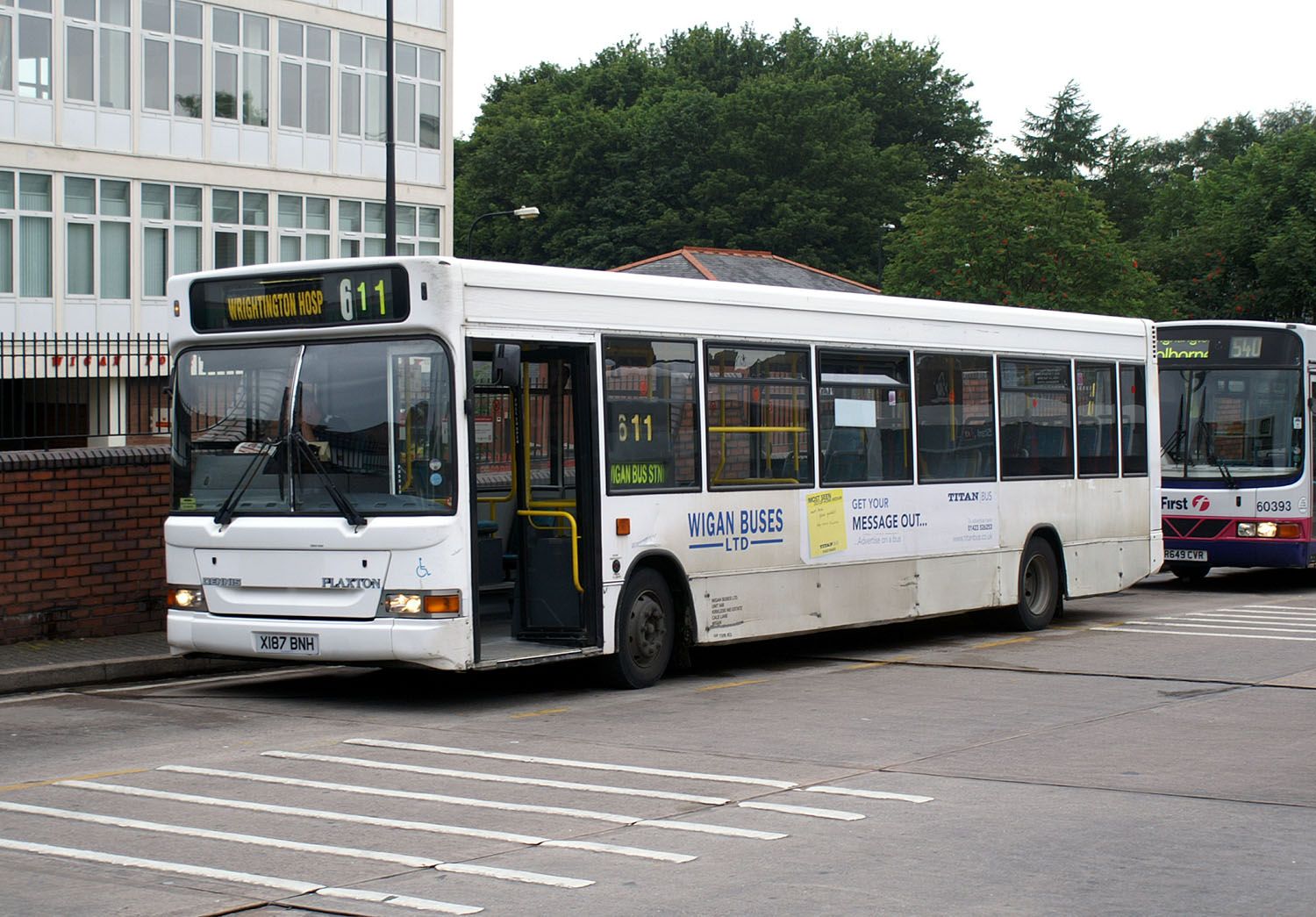 Buses parking besides a building in Wigan