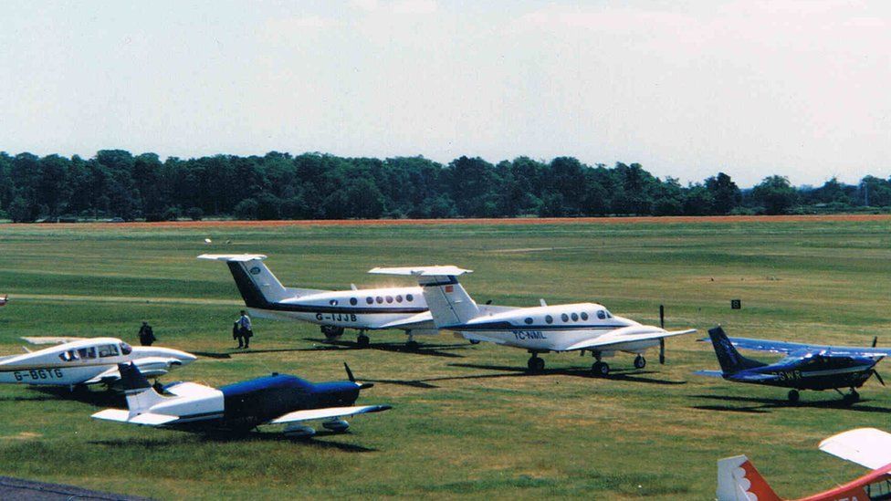 an airport with six planes