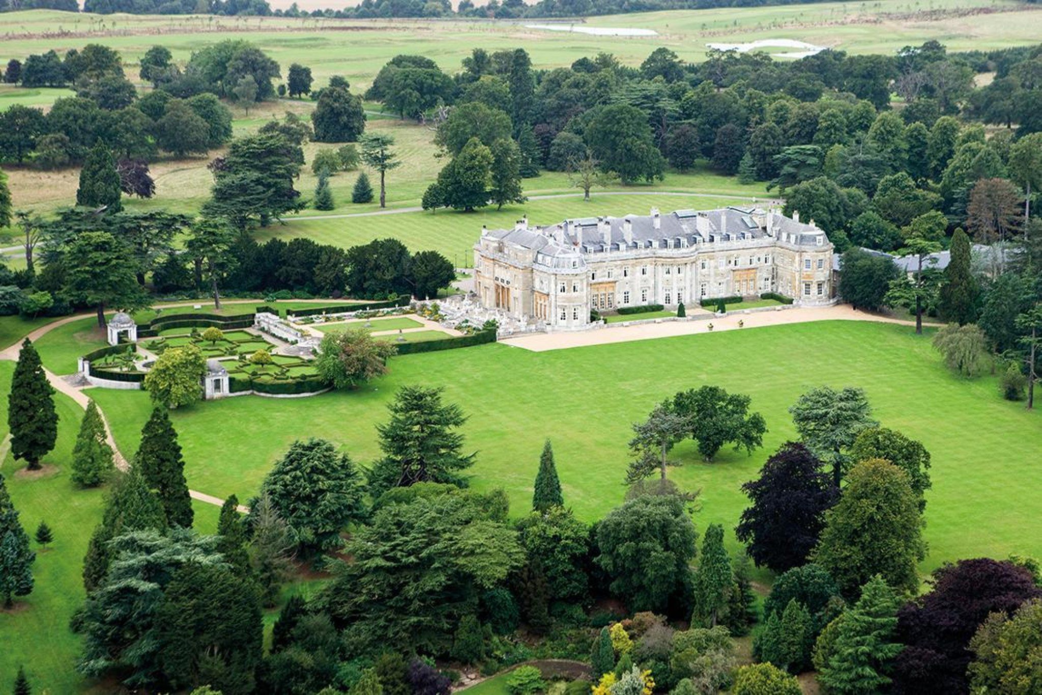 white and big building surrounded by trees