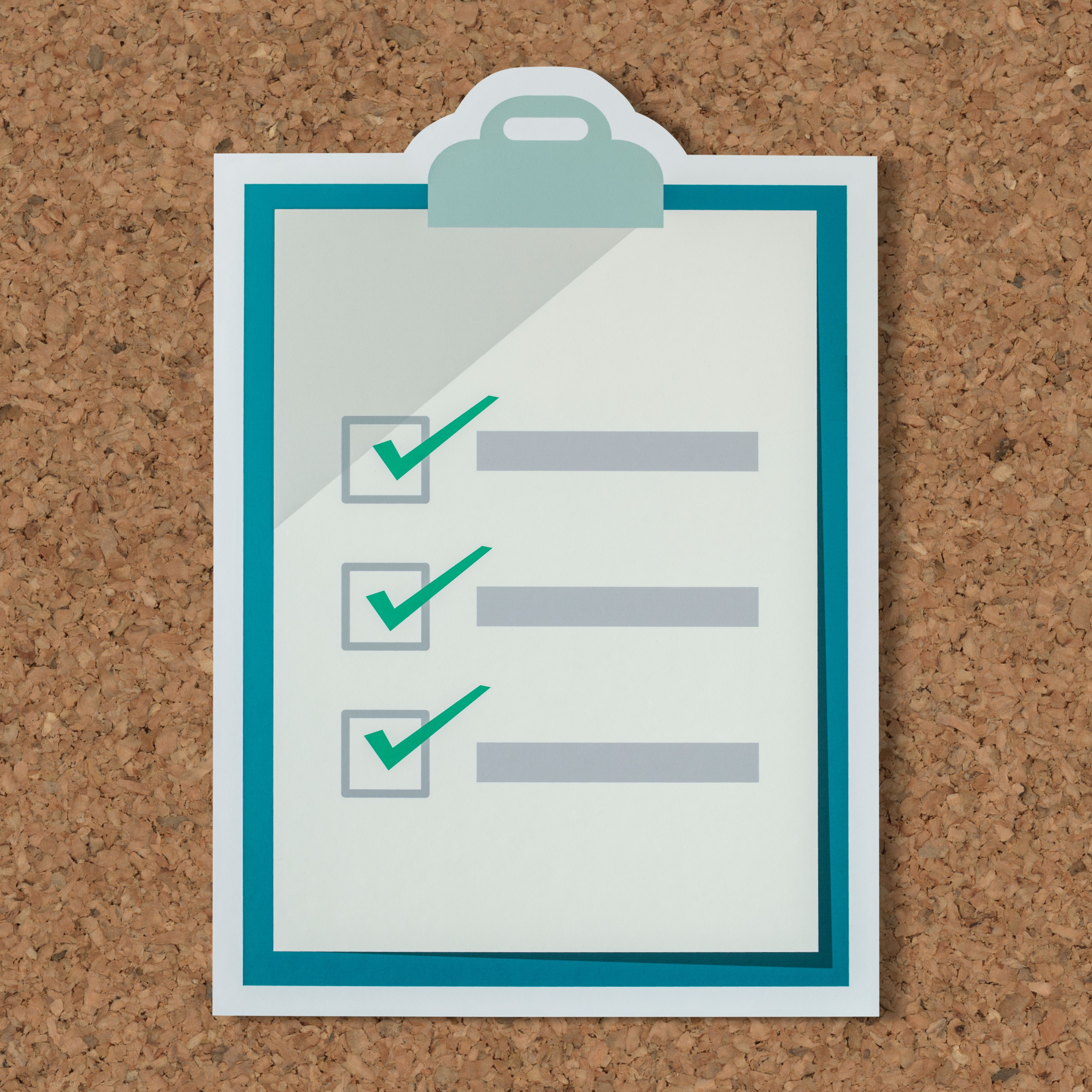 A tenant reference checklist on a wooden floor with all 3 points fully ticked green for approval.