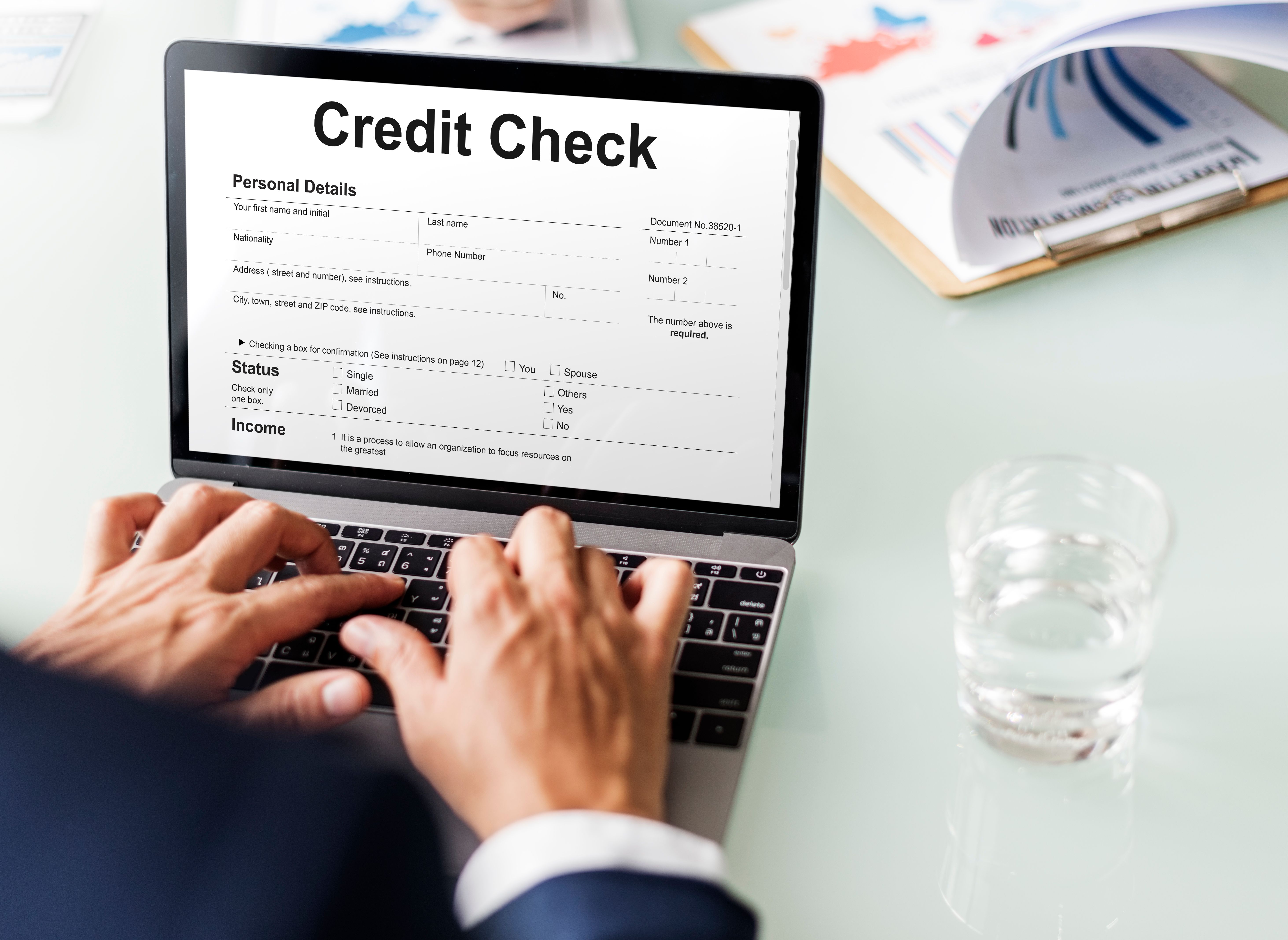 A tenant filling in a credit check form as part of his rental application for a Build To Rent property.