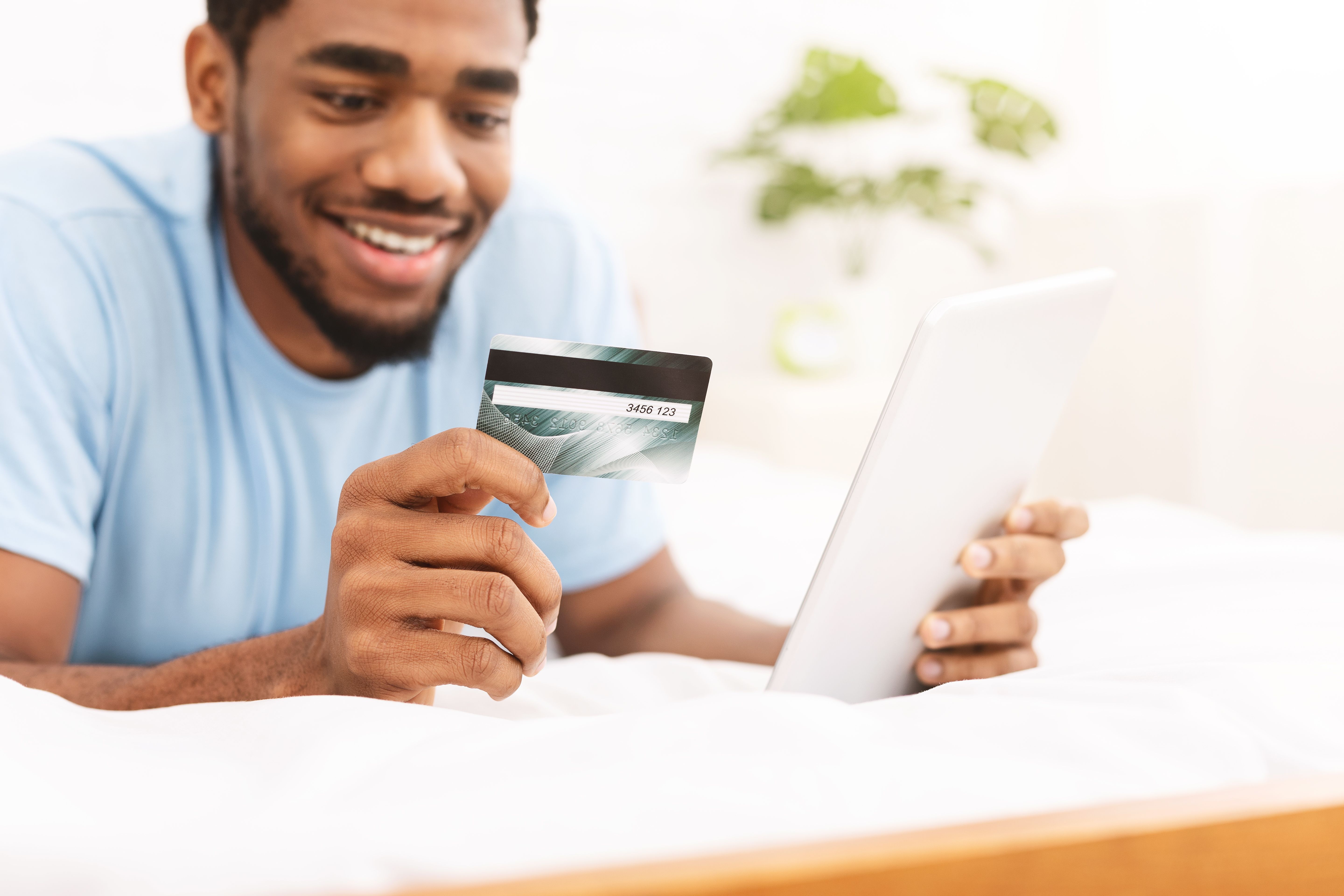 A man carrying out a credit check from his bank card to apply for a Build To Rent property rental.