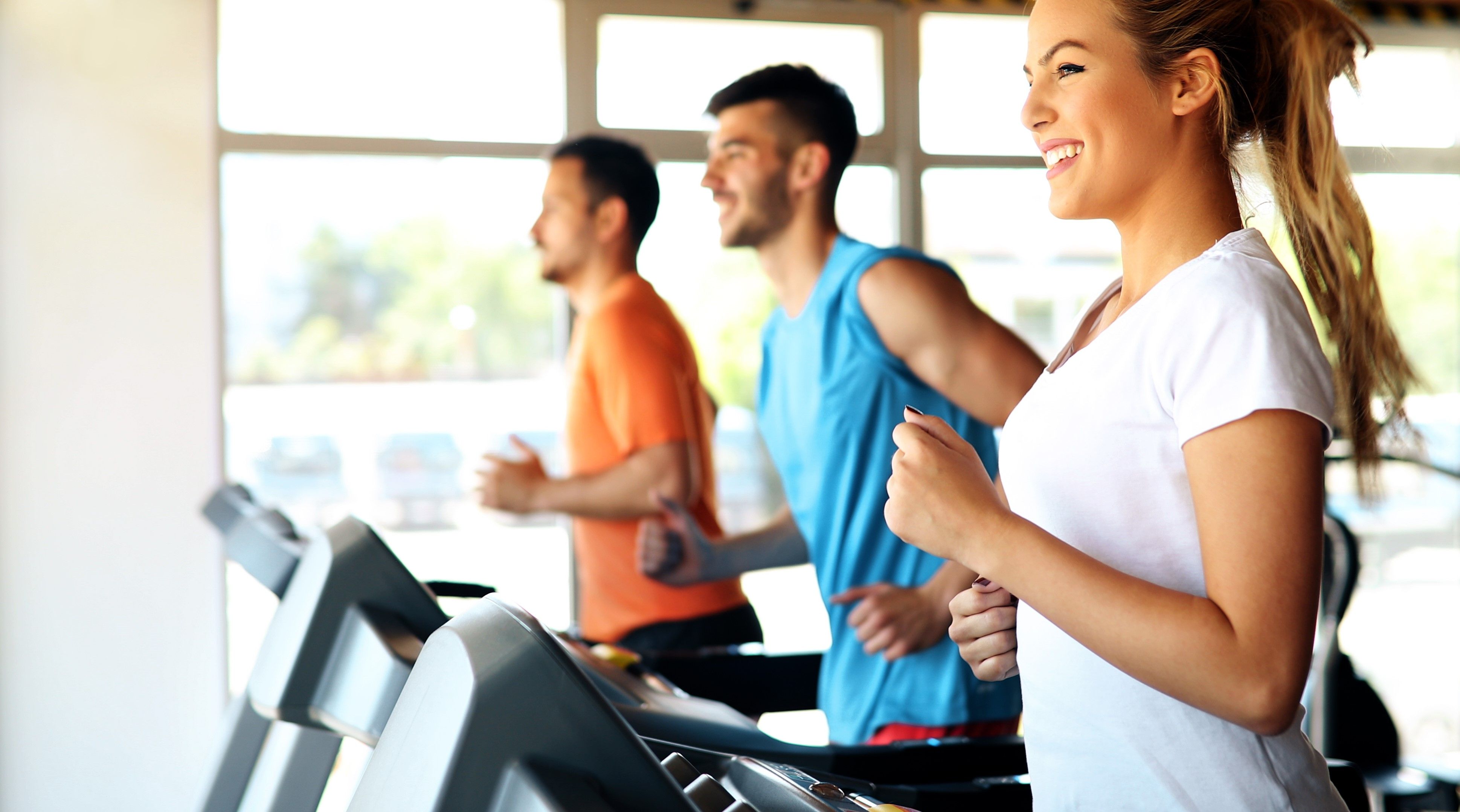 A group of tenants exercising together in their communal gym at their Build To Rent development.