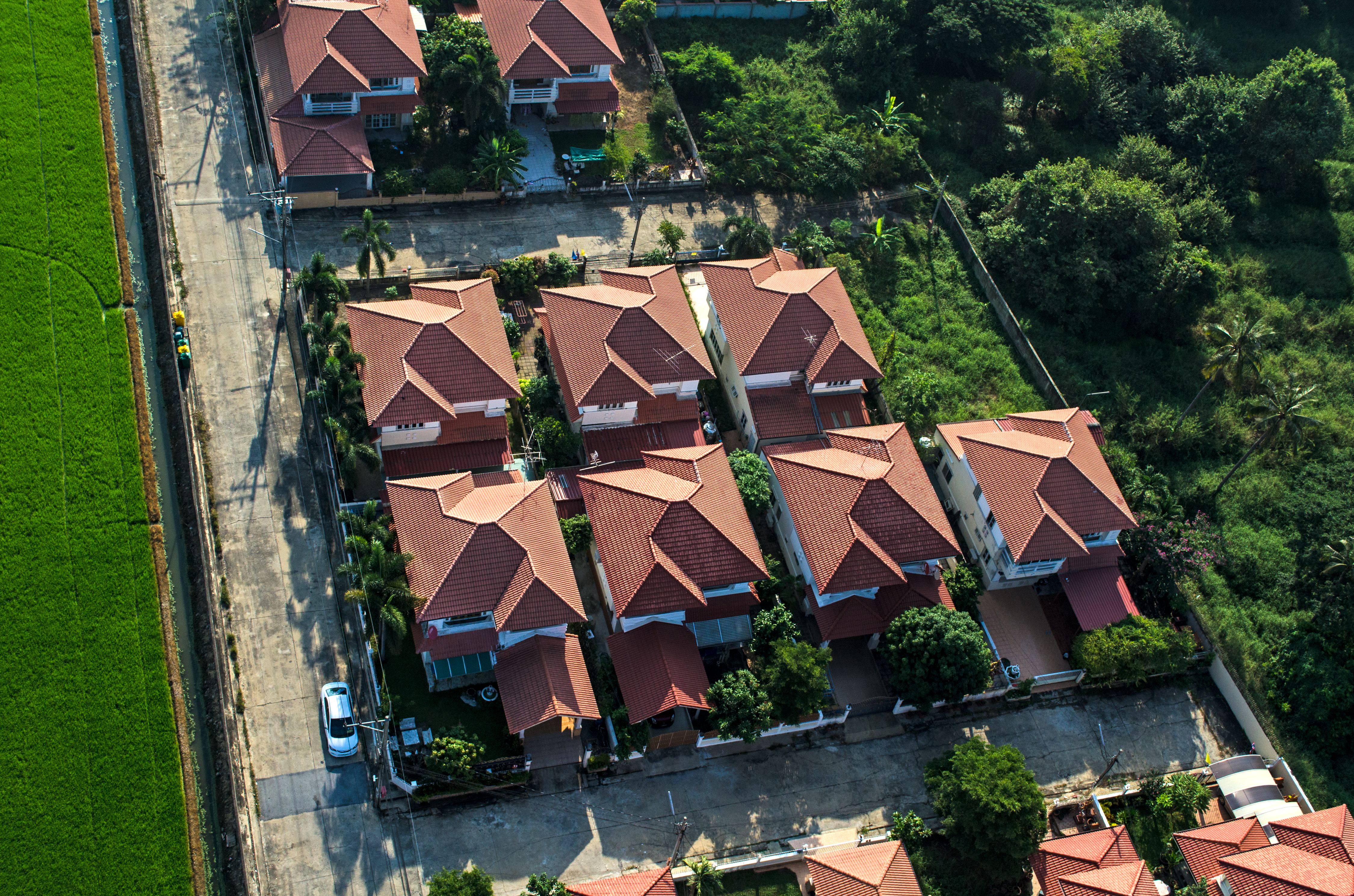 Red roofs in residential area housing, viewed from the air